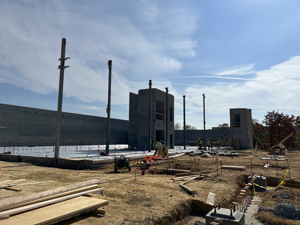 Pictured: Sheehy Subaru Springfield mid-construction, showing the radius wall for the showroom.