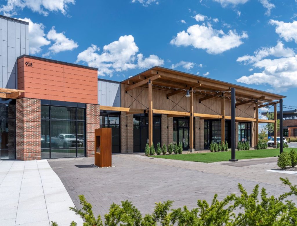 Exterior shot of a turf area in Embrey Mill along with a mass timber building.